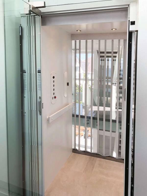 Cambridge Custom Residential Home Elevator with Clear Accordion gate from HomeLift