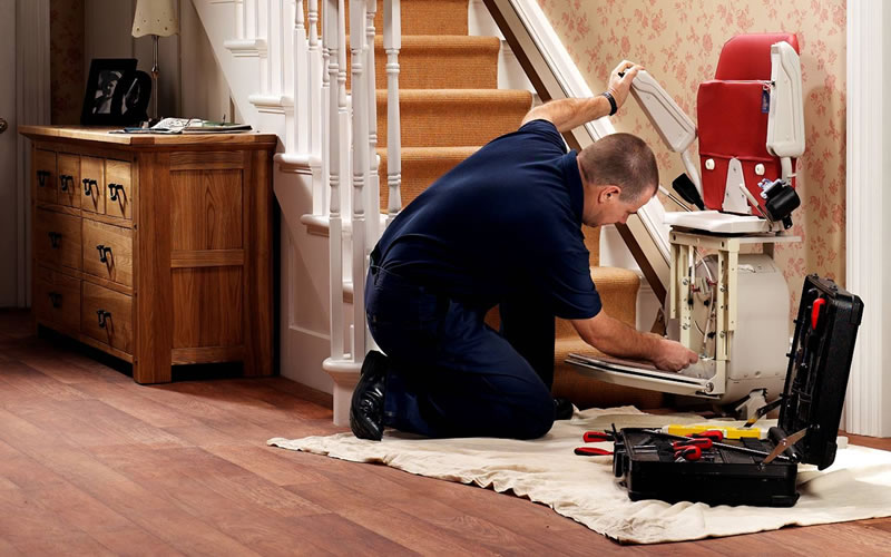 Homelift Technician Installing a straight stairlift