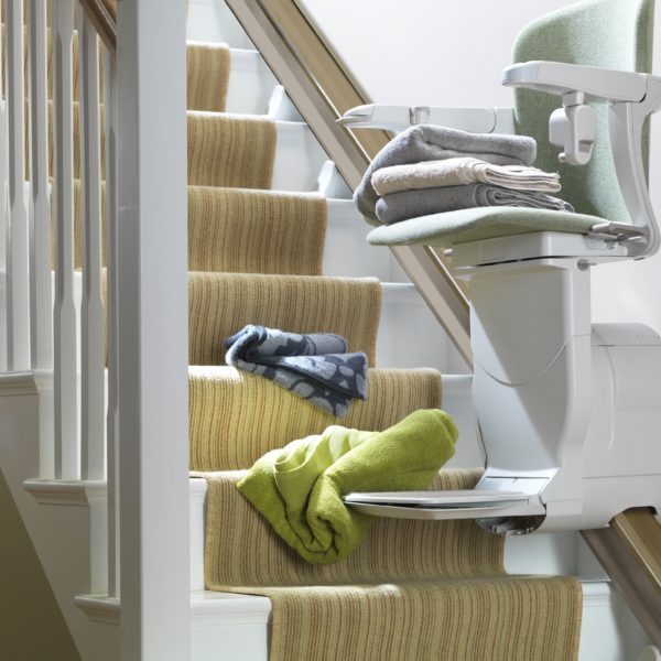 Stannah stairlift with laundry blocking the tracks