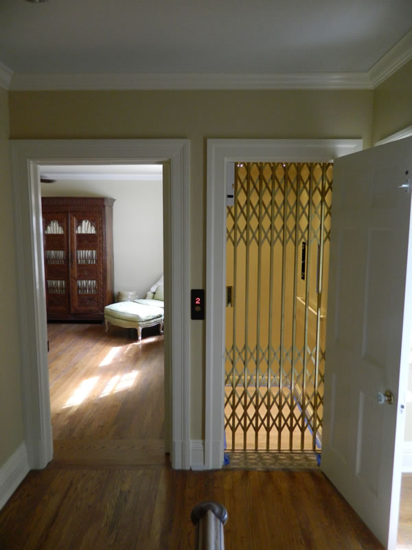 Custom Residential Home Elevator with Bronze Scissor gate from HomeLift