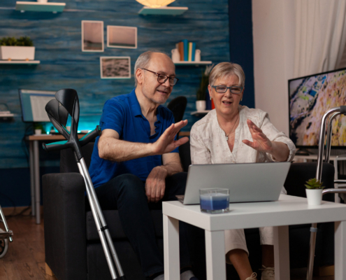 Older People Waving At Video Call Camera On Laptop 2021 12 17 01 39 27 Utc Copy Scaled