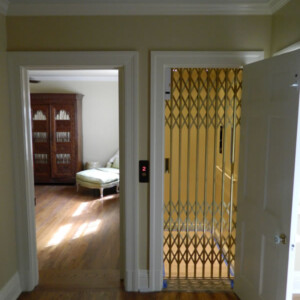 Custom Residential Home Elevator with Bronze Scissor gate from HomeLift
