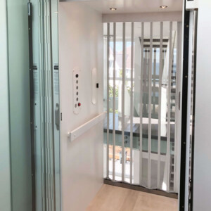 Cambridge Custom Residential Home Elevator with Clear Accordion gate from HomeLift