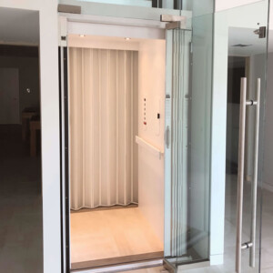 Cambridge Custom Residential Home Elevator with White Laminate Accordion gate from HomeLift